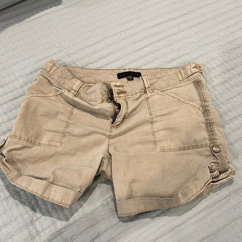 Khaki cargo style shorts.